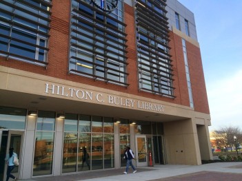Student entering through the Main Entrance of Buley